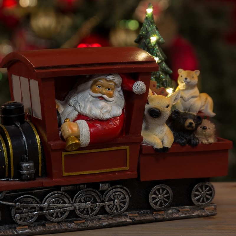 بابا نويل يقود قطار مع شـــجرة مضاءة من ســـانتا اكســبرس
